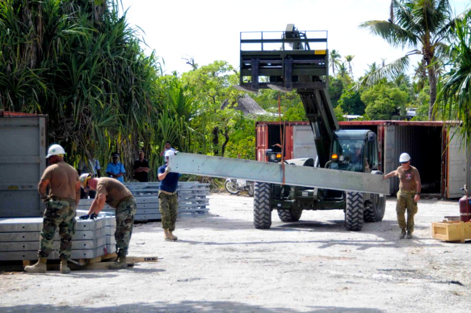 US Navy 090826-N-9689V-004 Engineers from the U.S. Navy, Australia and Canada reconstruct the Tanaea-Buota Bridge during a Pacific Partnership 2009 engineering civic action project