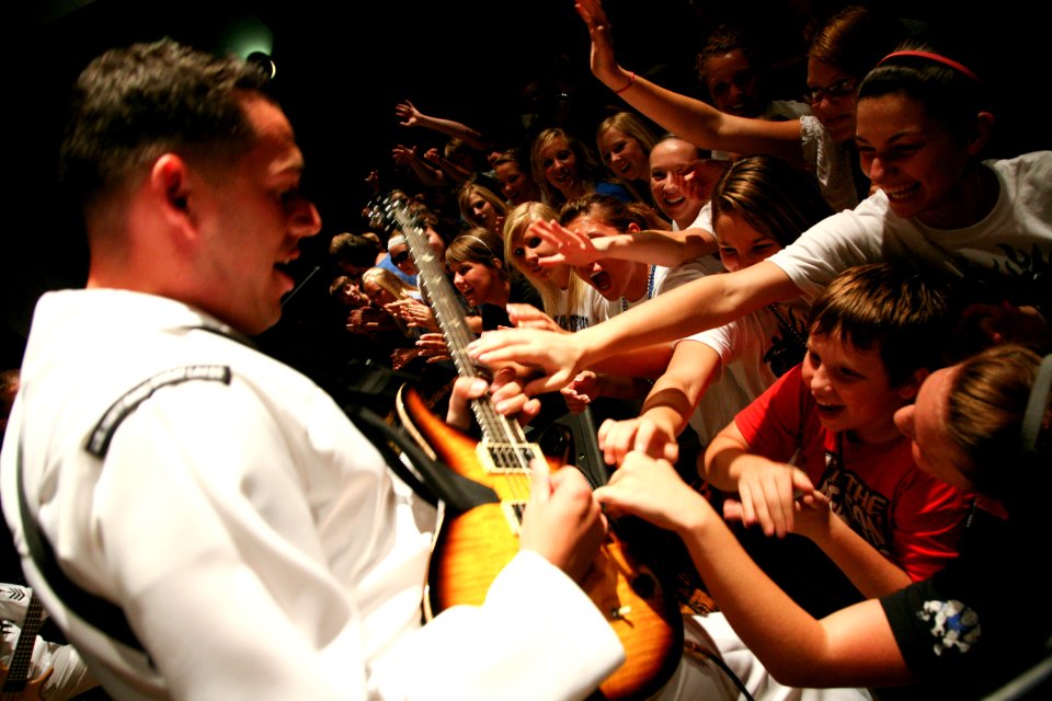 US Navy 090828-N-3271W-134 Musician 3rd Class Joel Packer gets in close with the students of Plattsmouth High School during a U.S. Navy Band Great Lakes