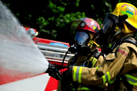 US Navy 090901-N-0807W-329 Firefighters from Commander, U.S. Naval Forces Japan (CNFJ) Regional fire department put out a fire during a annual national disaster prevention drill