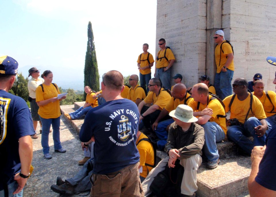 US Navy 090829-N-1429M-008 Chief (Sel.) Master-at-Arms Carrie Wesby, a member of the Naples-area chief selects, reads a wartime broadcast about the battle of Monte Cassino