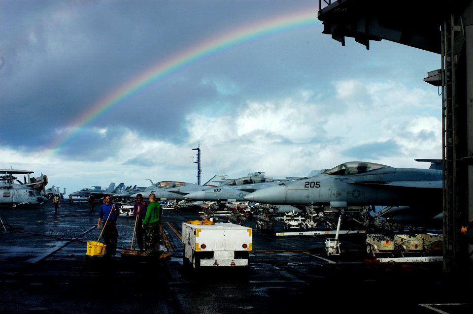 US Navy 090901-N-8421M-001 Sailors aboard the aircraft carrier USS Nimitz (CVN 68) clean the flight deck after a tropical rain shower