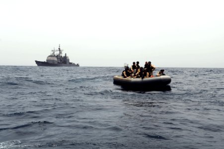 US Navy 090901-N-6814F-096 Sailors assigned to the guided-missile cruiser USS Anzio (CG 68) approach a skiff for questioning