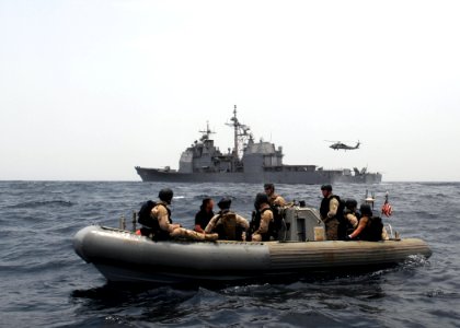 US Navy 090901-N-6814F-046 Sailors assigned to the guided-missile cruiser USS Anzio (CG 68) and members of U.S. Coast Guard maritime safety and security team 91104 prepare to investigate a skiff during a maritime security opera