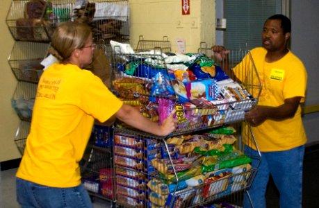 US Navy 090902-N-6724S-034 Chief petty officers and chief petty officer Selects from Naval Amphibious Base Little Creek pack boxes of food at the Foodbank of Southeastern Virginia