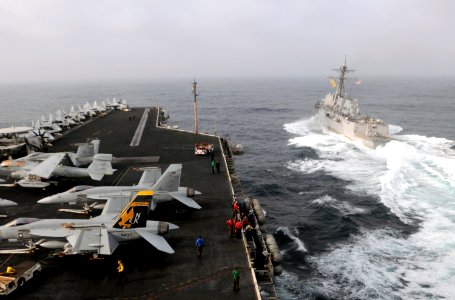 US Navy 090906-N-4995K-224 The Arleigh Burke-class guided-missile destroyer USS Gridley (DDG 101) transits away from the aircraft carrier USS Ronald Reagan (CVN 76) after a fueling at sea