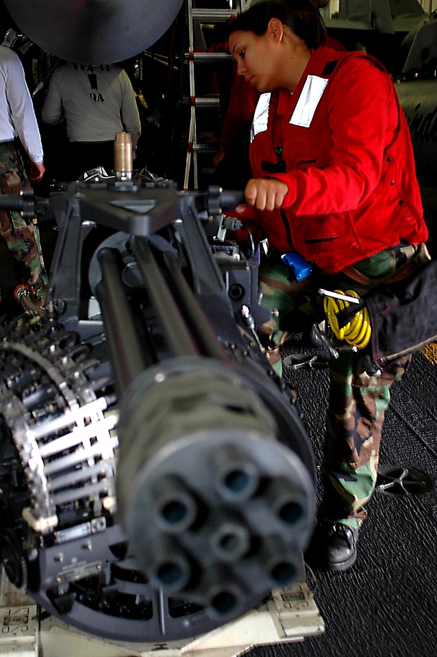 US Navy 090901-N-8960W-033 Aviation Ordnanceman Airman Amy Landa, assigned to the Black Aces Strike Fighter Squadron (VFA) 41, performs maintenance on M61A2 20mm cannon