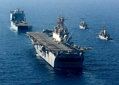 US Navy 090905-N-3165S-566 The multi-purpose amphibious assault ship USS Bataan (LHD 5) takes position in formation behind the Royal Navy fleet auxiliary ship Lyme Bay (L 3007)