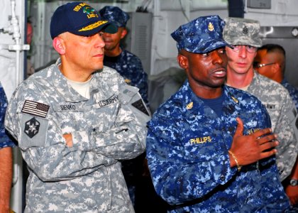 US Navy 090907-N-1512O-051 Senior Chief Hospital Corpsman Huben Phillips, medical departments leading chief petty officer aboard the multi-purpose amphibious assault ship USS Bataan (LHD 5), gives a brief on Bataan's medical ca