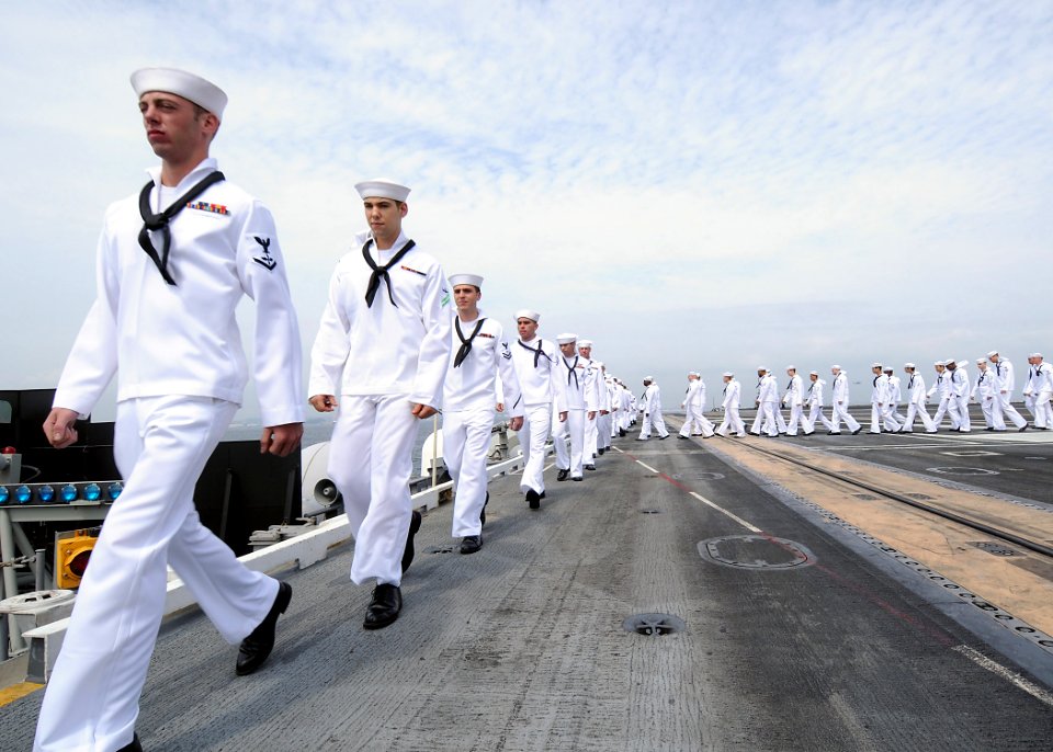 US Navy 090903-N-1062H-027 Sailors man the rails aboard the aircraft carrier USS George Washington (CVN 73) as the ship returns to Yokosuka, Japan after a three-month deployment