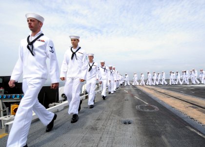 US Navy 090903-N-1062H-027 Sailors man the rails aboard the aircraft carrier USS George Washington (CVN 73) as the ship returns to Yokosuka, Japan after a three-month deployment