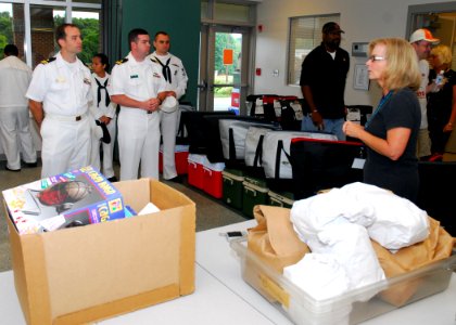 US Navy 090903-N-2903M-001 Sailors from Navy Recruiting District Nashville, Naval Operational Support Center Knoxville and various other commands prepare to deliver food as part of the Meals on Wheels program