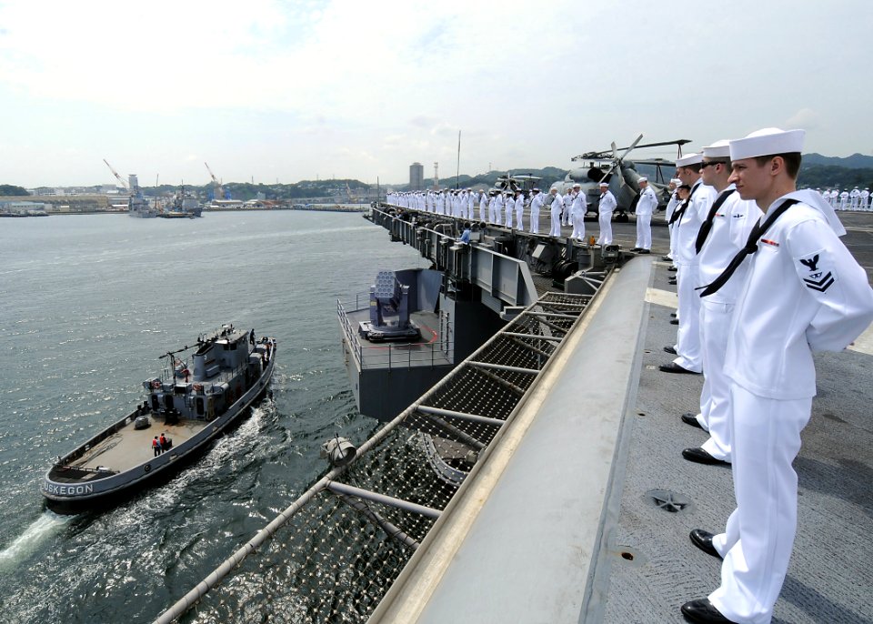 US Navy 090903-N-1062H-048 Sailors man the rails on the flight deck of the aircraft carrier USS George Washington (CVN 73) as the ship returns to Yokosuka, Japan