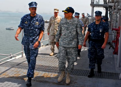 US Navy 090907-N-1512O-012 Capt. Sam Howard, commanding officer of the multi-purpose amphibious assault ship USS Bataan (LHD 5), guides Maj. Gen. Dean Sienko, commander of 3rd Medical Deployed Support Command, on a tour of the photo