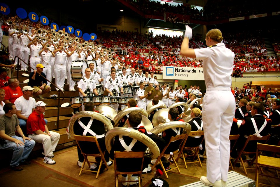 US Navy 090905-N-3271W-096 Midshipman 1st Class Stephanie Stamm conducts the U.S. Naval Academy Drum and Bugle Corps at the Skull Rally, a pre-game event before the U.S. Naval Academy and Ohio State University football game