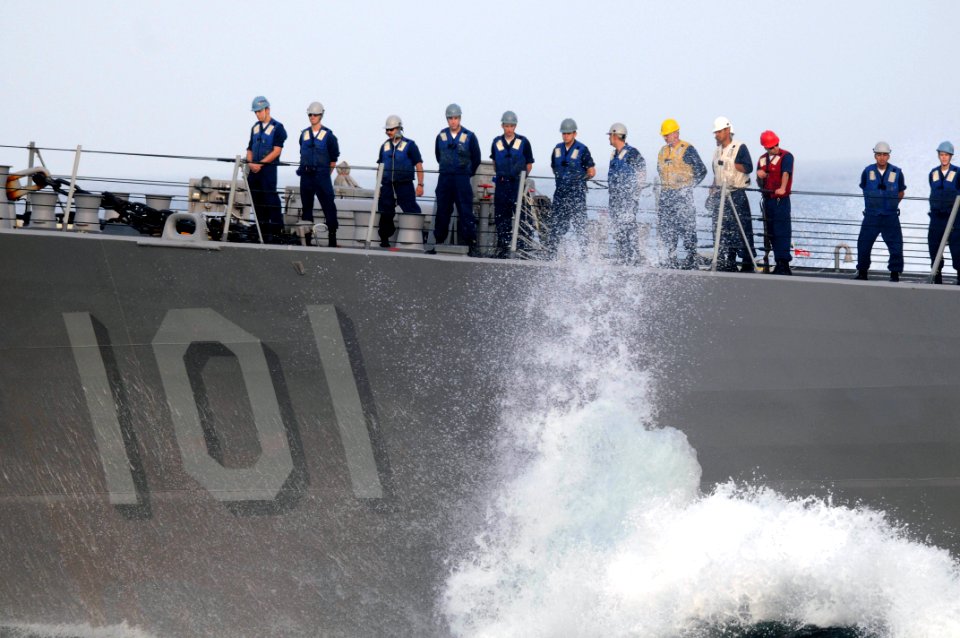 US Navy 090906-N-9132C-122 ailors aboard the Arleigh Burke-class guided-missile destroyer USS Gridley (DDG 101) stand on the bow to connect fuel lines with the aircraft carrier USS Ronald Reagan (CVN 76) during a fueling at sea