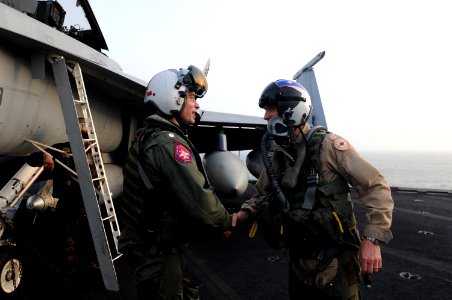 US Navy 090906-N-4995K-325 Maj. Gen. C.S. Sullivan, the director of Air Coordination Element, International Security Assistance Force, thanks Cmdr. Kevin Aanastad, an F-A-18F Super Hornet pilot, after they landed aboard the air