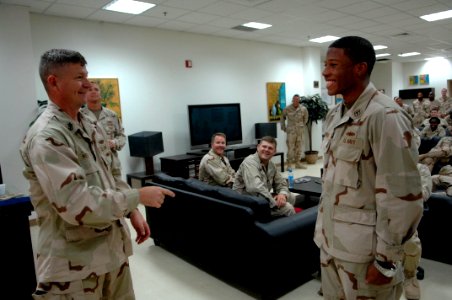 US Navy 090906-N-9818V-451 Master Chief Petty Officer of the Navy (MCPON) Rick West takes questions from Sailors during an all-hands call during a tour of Expeditionary Medical Facility Kuwait photo