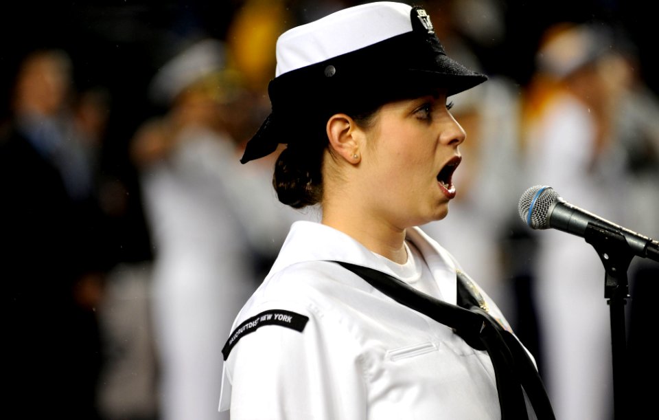 US Navy 090911-N-0413R-218 Musician 3rd Class Laura Carey sings the national anthem during a pre-game ceremony at Yankee Stadium