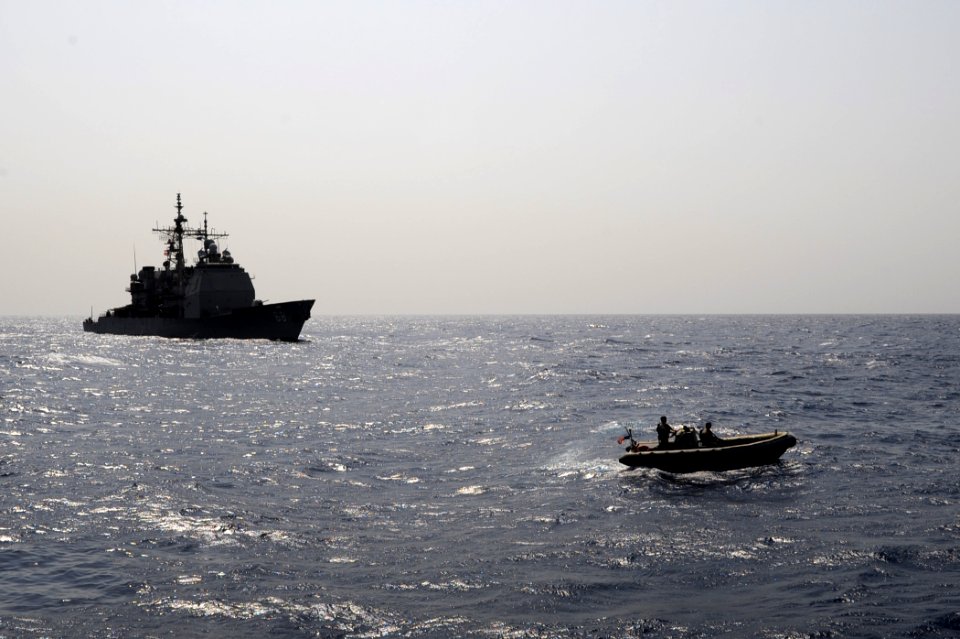 US Navy 090908-N-6814F-126 A rigid hull inflatable boat maneuvers during a boarding operation near the guided-missile cruiser USS Anzio (CG 68)