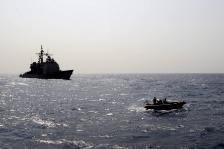 US Navy 090908-N-6814F-126 A rigid hull inflatable boat maneuvers during a boarding operation near the guided-missile cruiser USS Anzio (CG 68)
