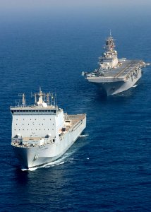 US Navy 090905-N-3165S-599 The multi-purpose amphibious assault ship USS Bataan (LHD 5) takes position in formation behind the Royal Navy fleet auxiliary ship Lyme Bay (L 3007)