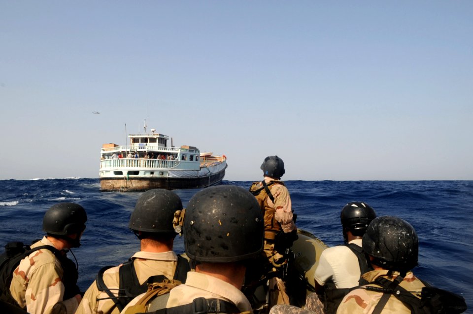 US Navy 090908-N-6814F-016 Members of the visit, board, search, and seizure team of the guided-missile cruiser USS Anzio (CG 68) and U.S. Coast Guard Maritime Safety and Security Team 91104 approach a dhow near Anzio
