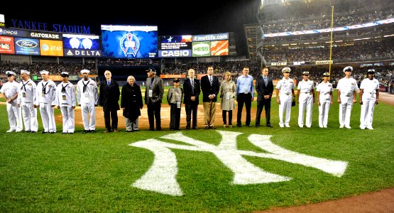 US Navy 090911-N-0413R-155 Sailors assigned to the amphibious transport dock ship Pre-Commisioning Unit (PCU) New York (LPD 21) and members of the commissioning committee are introduced during a pre-game ceremony at Yankee Stad photo
