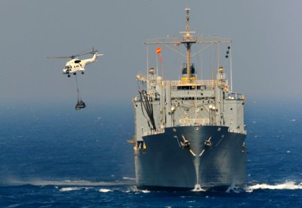 US Navy 090909-N-5345W-041 An SA-330 Puma helicopter lifts a load of stores from the Military Sealift Command combat stores ship USNS San Jose (T-AFS 7) during a vertical replenishment with the amphibious dock landing ship USS