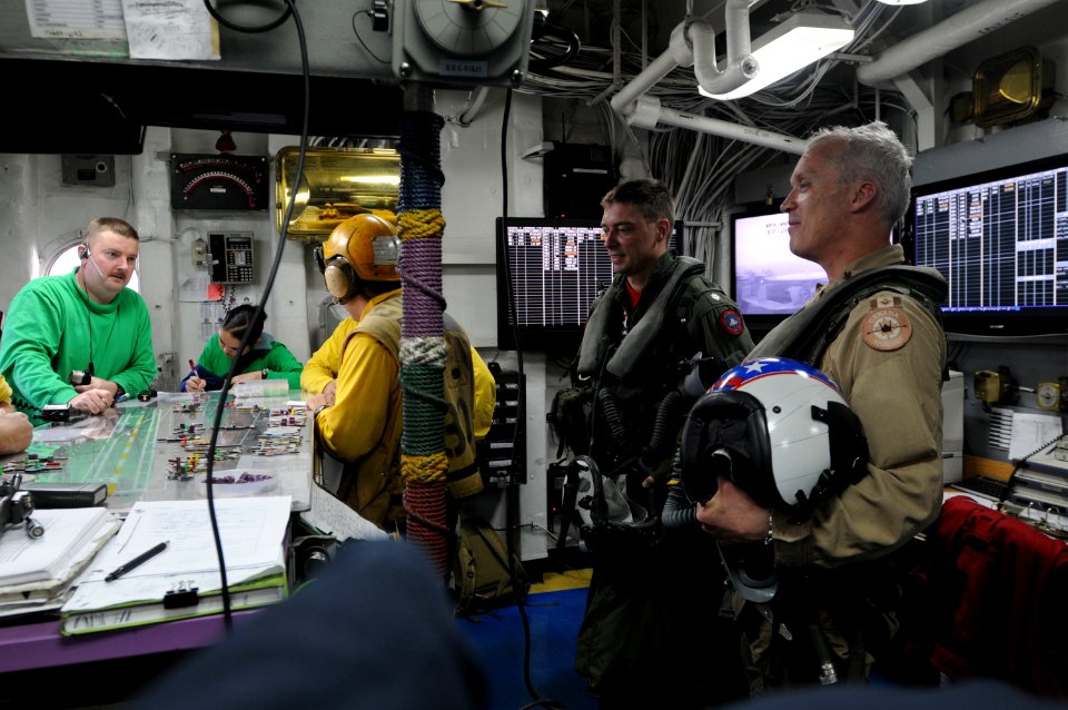 US Navy 090906-N-4995K-353 Maj. Gen. C.S. Sullivan, the director of Air Coordination Element, International Security Assistance Force, talks to the handler in flight deck control aboard the aircraft carrier USS Ronald Reagan (C