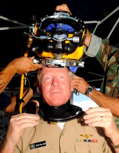 US Navy 090911-N-7498L-021 Adm. Robert Willard, commander, U.S. Pacific Fleet, dons diving headgear after presenting Mobile Diving and Salvage Unit (MDSU) 1 the Meritorious Unit Commendation award at Naval Station Pearl Harbor photo