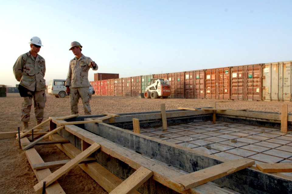 US Navy 090910-N-9818V-573 Builder 1st Class Jason Shurtz shows Master Chief Petty Officer of the Navy (MCPON) Rick West the work sites of Naval Mobile Construction Battalion (NMCB) 74 during a tour of the base in Kandahar