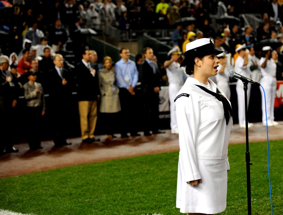 US Navy 090911-N-0413R-216 Musician 3rd Class Laura Carey sings the national anthem during a pre-game ceremony at Yankee Stadium