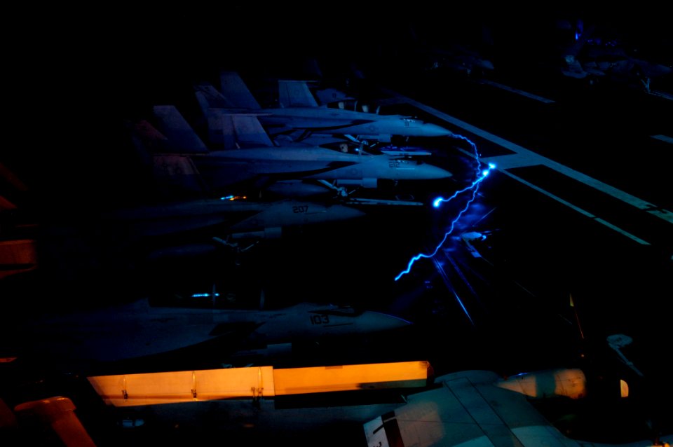 US Navy 090912-N-3038W-011 Sailors aboard the aircraft carrier USS Nimitz (CVN 68) prepare aircraft for flight operations during a transit of the Strait of Malacca
