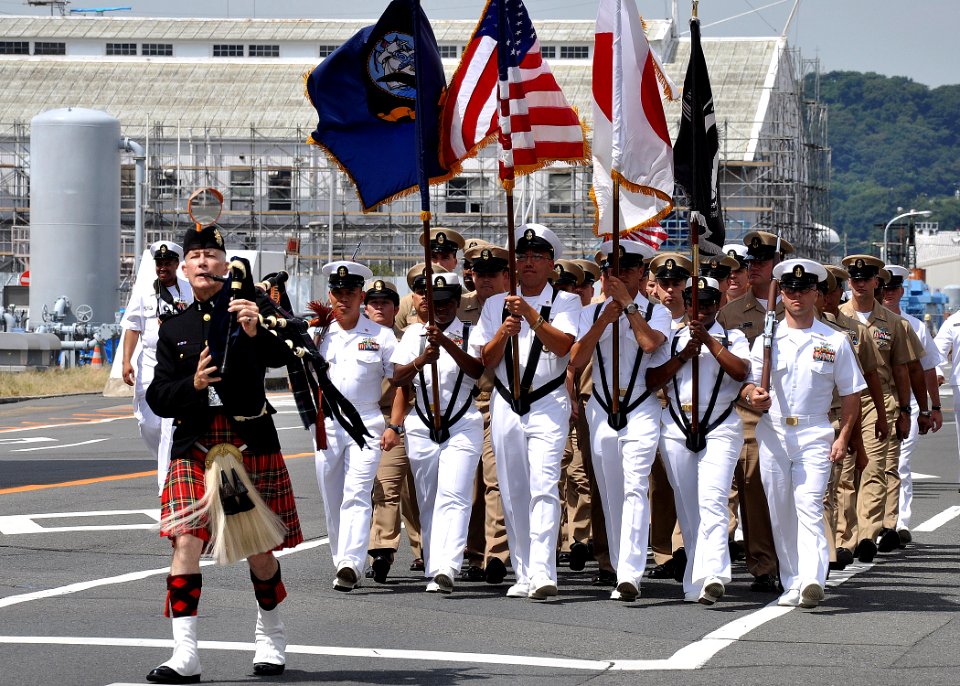 US Navy 090911-N-2013O-094 Bagpiper Francis Hunter leads chief petty officers assigned to Commander, Fleet Activities Yokosuka during a 9-11 memorial parade