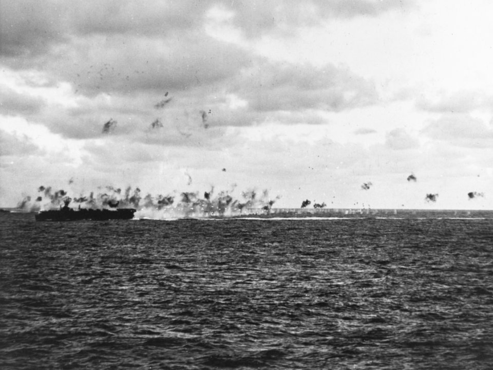USS Belleau Wood (CVL-24) under attack on 23 February 1944 (80-G-218423)
