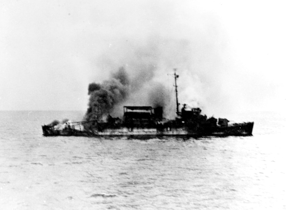 USS Bates (APD-47) burning off Ie Shima, Japan, 25 May 1945 (NH 66450)