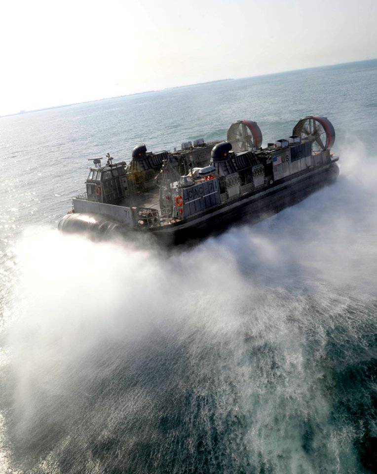 US Navy 090912-N-5345W-038 Landing Craft, Air Cushion (LCAC) 71, assigned to Assault Craft Unit (ACU) 4, returns to the Kuwaiti shore to retrieve equipment and Marines from the 22nd Marine Expeditionary Unit (22nd MEU)