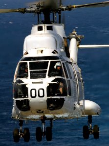 US Navy 090909-N-5345W-049 The pilot of an SA-330 Puma helicopter looks out from the cockpit after delivering stores from the Military Sealift Command combat stores ship USNS San Jose (T-AFS 7)