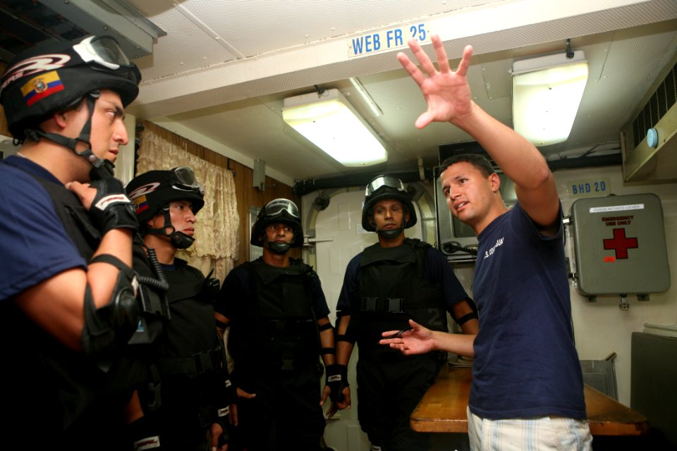 US Navy 090913-N-4936C-079 U.S. Coast Guard Lt. Cliff Harrison briefs Ecuadorian sailors during an FA PANAMAX 2009 maritime boarding training exercise at Vasco Nunez de Balboa Naval Base, Panama