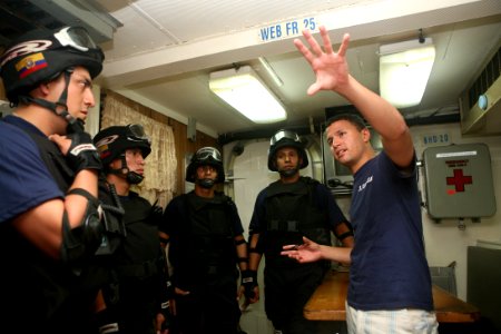 US Navy 090913-N-4936C-079 U.S. Coast Guard Lt. Cliff Harrison briefs Ecuadorian sailors during an FA PANAMAX 2009 maritime boarding training exercise at Vasco Nunez de Balboa Naval Base, Panama