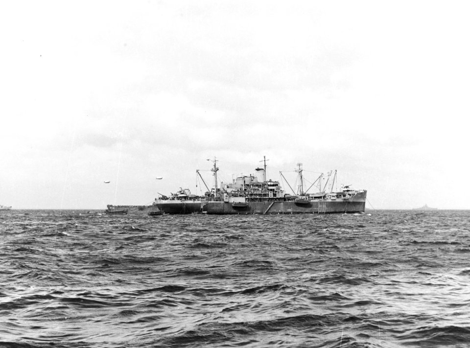 USS Bayfield (APA-33) lowering landing craft off Utah Beach on 6 June 1944 (80-G-252377)