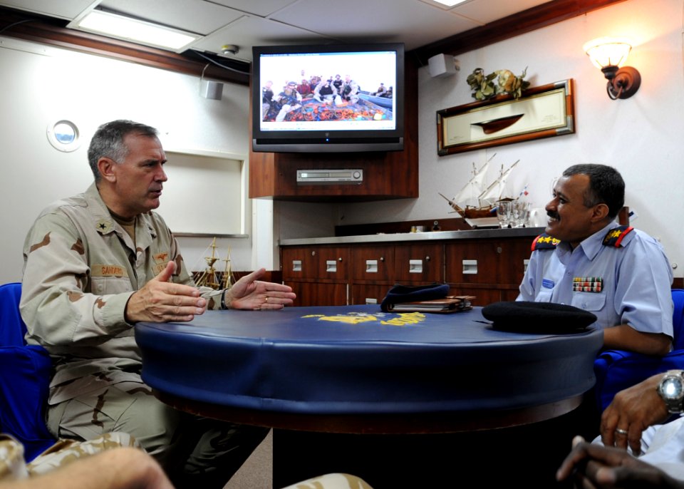 US Navy 090912-N-6814F-089 Rear Adm. Scott E. Sanders speaks with Col. Lofta Al Barati during a visit aboard the guided-missile cruiser USS Anzio (CG 68)