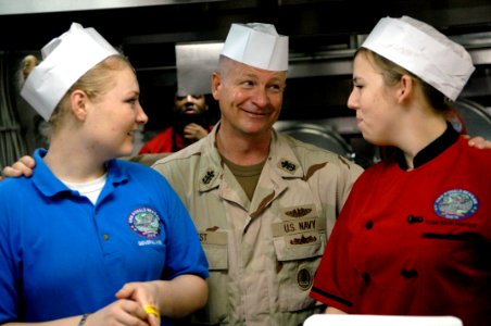 US Navy 090913-N-9818V-339 Master Chief Petty Officer of the Navy (MCPON) Rick West speaks with Sailors in the galley of the aircraft carrier USS Ronald Reagan (CVN 76) during a tour of the ship
