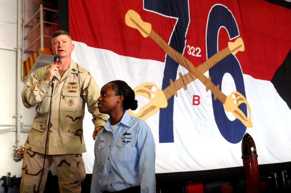 US Navy 090913-N-3659B-491 Master Chief Petty Officer of the Navy (MCPON) Rick West takes a moment to recognize Boatswain's Mate Seaman Charity Felton during an all-hands call aboard the aircraft carrier USS Ronald Reagan (CVN
