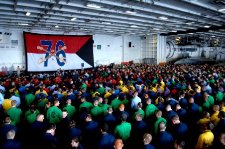 US Navy 090913-N-9818V-150 Sailors gather in the hangar bay of the aircraft carrier USS Ronald Reagan (CVN 76) for an all-hands call with Master Chief Petty Officer of the Navy (MCPON) Rick West