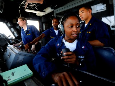 US Navy 090914-N-5345W-045 Boatswain's Mate 3rd Class April Sanders mans the helicopter control tower phone-talker station with Ensign Judith Bates, far left, and Lt. Tamara Sonon