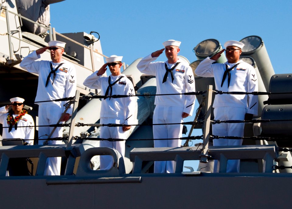 US Navy 090914-N-6674H-004 Sailors aboard the guided-missile destroyer USS Hopper (DDG 70) render a hand salute as they depart Naval Station Pearl Harbor for a scheduled deployment to the U.S. 5th Fleet area of responsibility