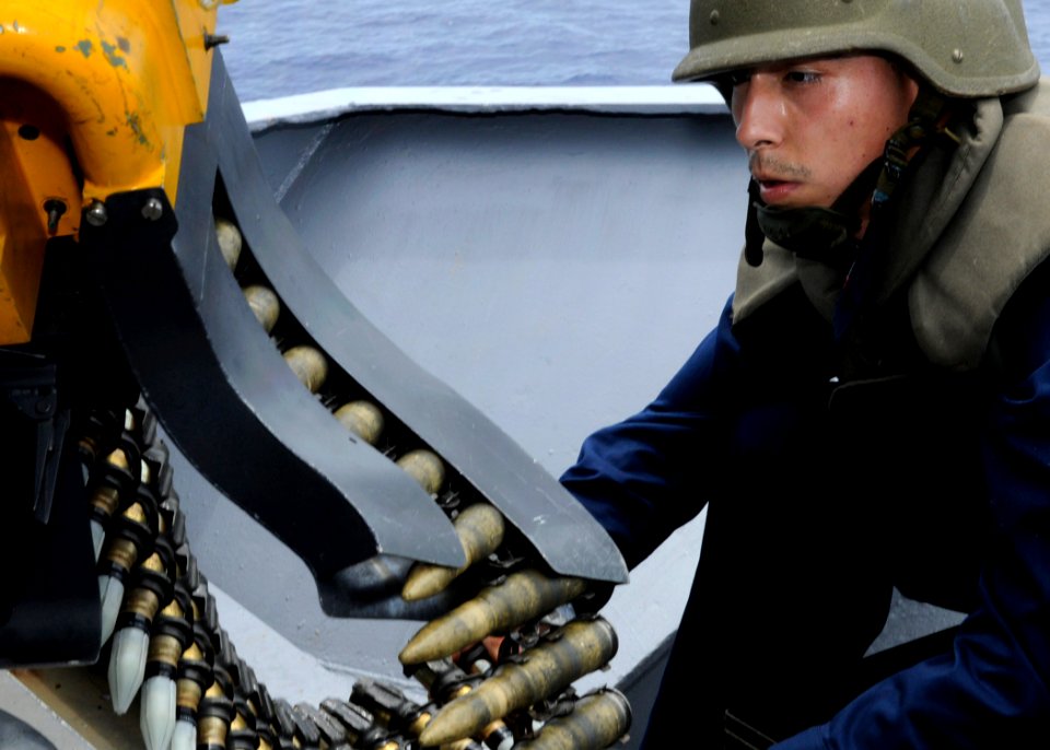 US Navy 090914-N-7478G-163 Fire Controlman 3rd Class Ivan Galvez loads ammunition into the Phalanx Close-In Weapons System (CIWS) aboard the amphibious command ship USS Blue Ridge (LCC 19)