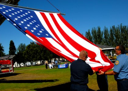 US Navy 090912-N-9860Y-008 Members of Navy Region Northwest Fire and Emergency Services raise the national ensign