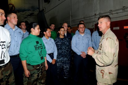 US Navy 090912-N-4995K-186 Master Chief Petty Officer of the Navy (MCPON) Rick West speaks to Sailors assigned to Strike Fighter Squadron (VFA) 25 in the hangar bay of the aircraft carrier USS Ronald Reagan (CVN 76)